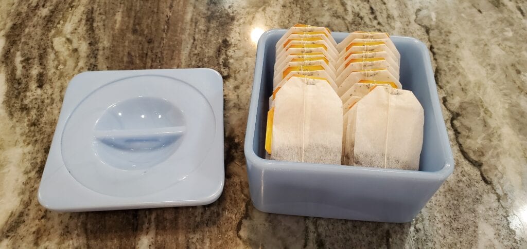 Blue refrigerator storage dish used to hold tea bags